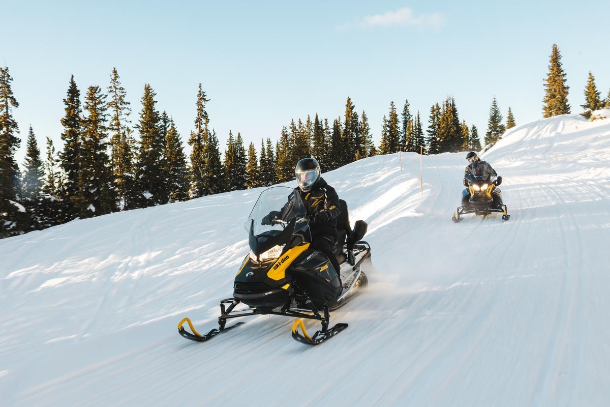 Ski-Doo snowmobiles on a Colorado mountain trail